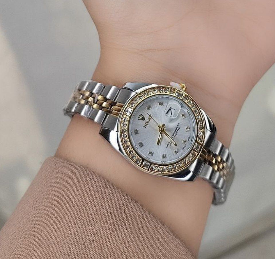 Rolex رولکس dajust  دورنگین موتور  ضدآب  دارای روزشمار  مارک حک شده رولکس بر روی پیچ تنظیم  بند استیل رنگ ثابت شیشه (تلسکوپی) کریستال ضدخش